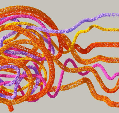 Abstract illustration of artificial intelligence and business technology, featuring a colourful network of interconnected orange, yellow, pink and purple data strands forming a complex digital brain shape with flowing connections extending outward.