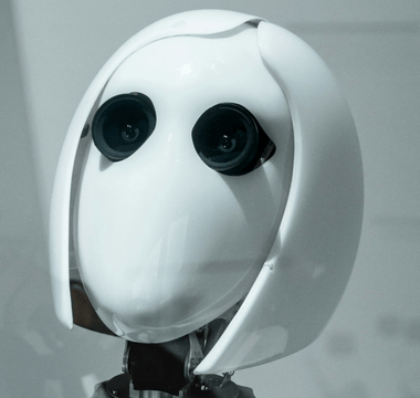 White humanoid robot representing artificial intelligence and automation, used to illustrate how AI is transforming audit work and graduate training.