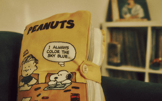Vintage Peanuts notebook featuring Snoopy and Charlie Brown, illustrating the enduring appeal of the Peanuts brand following Sony’s majority acquisition.