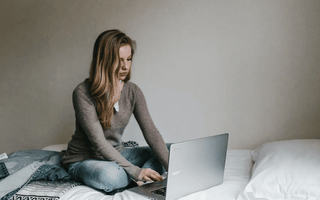 Focused student studying ACCA materials on a laptop — representing the challenge and preparation needed for the toughest ACCA exams such as SBL, AAA, and AFM.