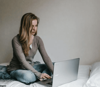 Focused student studying ACCA materials on a laptop — representing the challenge and preparation needed for the toughest ACCA exams such as SBL, AAA, and AFM.