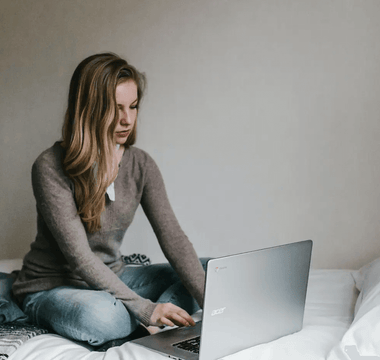 Focused student studying ACCA materials on a laptop — representing the challenge and preparation needed for the toughest ACCA exams such as SBL, AAA, and AFM.