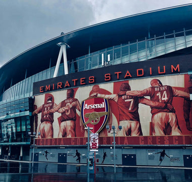 Arsenal’s Emirates Stadium in London, symbolising team identity and rivalry, referenced in a discussion on culture fit and recruitment decisions in the workplace.