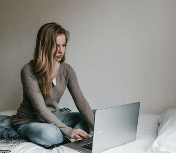 Focused student studying ACCA materials on a laptop — representing the challenge and preparation needed for the toughest ACCA exams such as SBL, AAA, and AFM.