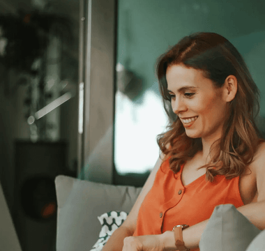 Smiling professional studying online with a laptop — representing learners comparing ACCA, CMA, and CIMA qualifications to choose the best career and salary path.