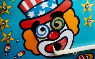 Colourful carnival clown face with spiral eyes and a patriotic hat, symbolising irony and misplaced judgment in a story about AI misuse in professional training.
