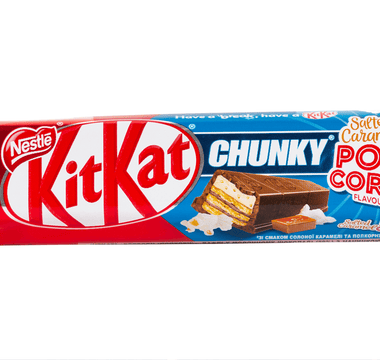   KitKat Chunky Salted Caramel Popcorn flavour bar in its colourful red, blue and white packaging, highlighting Nestlé’s bold and creative limited-edition flavour innovations.