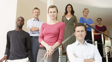 Group of people standing on a staircase indoors