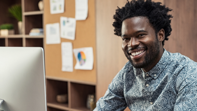 Happy ExP student at study desk, representing confidence gained through ExP’s full pass guarantee and supportive learning experience.