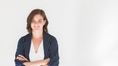 Professional ExP tutor smiling confidently, representing ExP’s outstanding pass rates and trusted online learning.