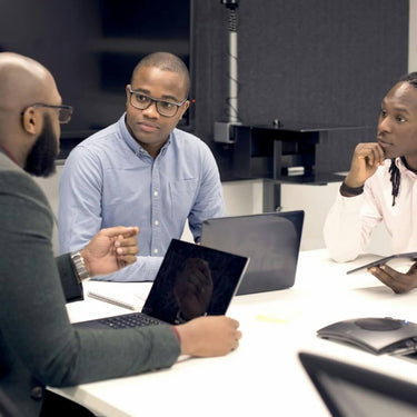 Finance professionals collaborating in a modern office, representing ExP’s network of Professional Ambassadors.